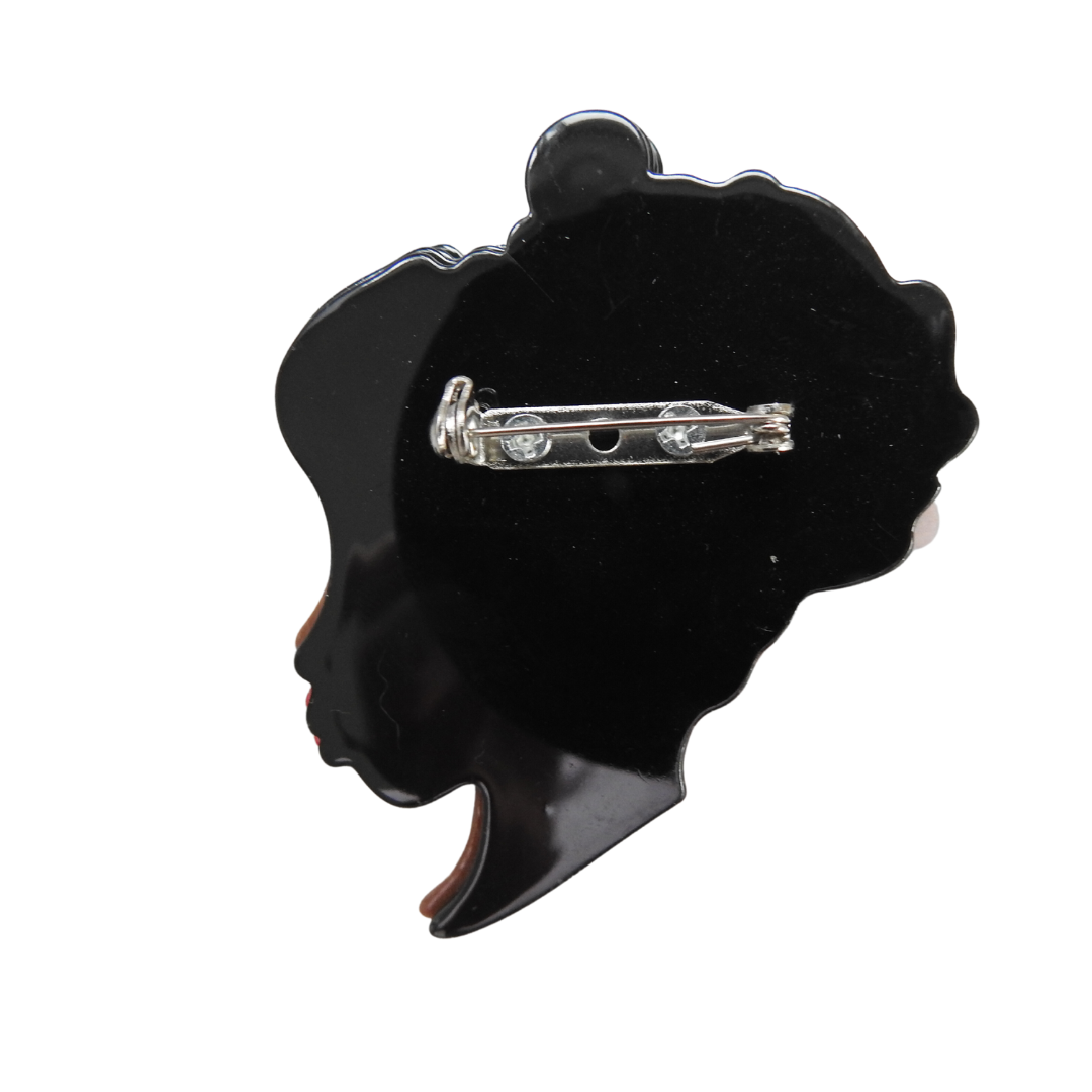 African lady's face brooch