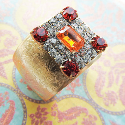 Crystal wide gold bracelet for ladies, made from a large sparkly orange geometric sparkly Czech glass button, anthro inspired bangle jewelry