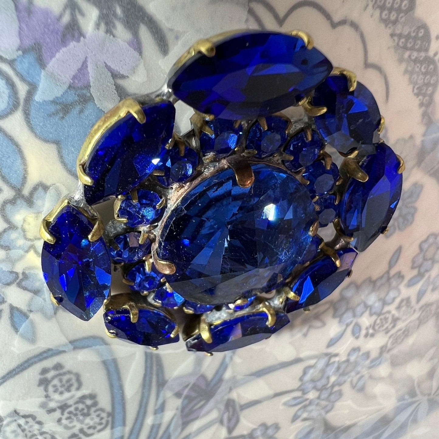 Gigantic blue crystal button made from fancy Czech glass. A nice way to add twinkle and glance to your outfit, accessory, or home decor.