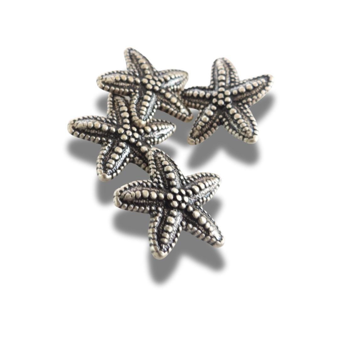 Set of 4 starfish-shaped 20mm metal buttons with a textured finish and shank back - for clothes, coats, crafts, and nautical-themed projects