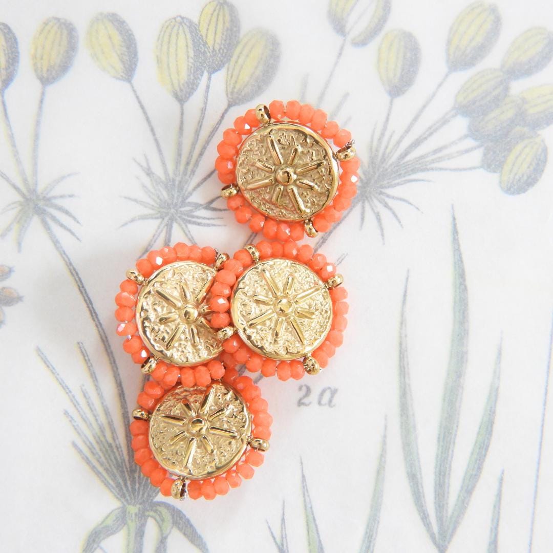 Set of 4 gold-toned 18mm fancy buttons for decorating. Roman medallion-inspired design, rosette motif, surrounded by orange glass seed beads