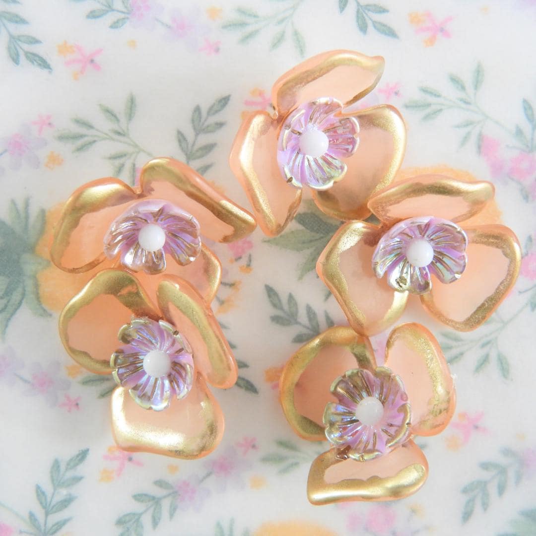 Set of 5 pastel flower buttons with shimmery finishes. Perfect for embellishing nude, beige, tan accessories, crafts, or DIY jewelry. 20 mm