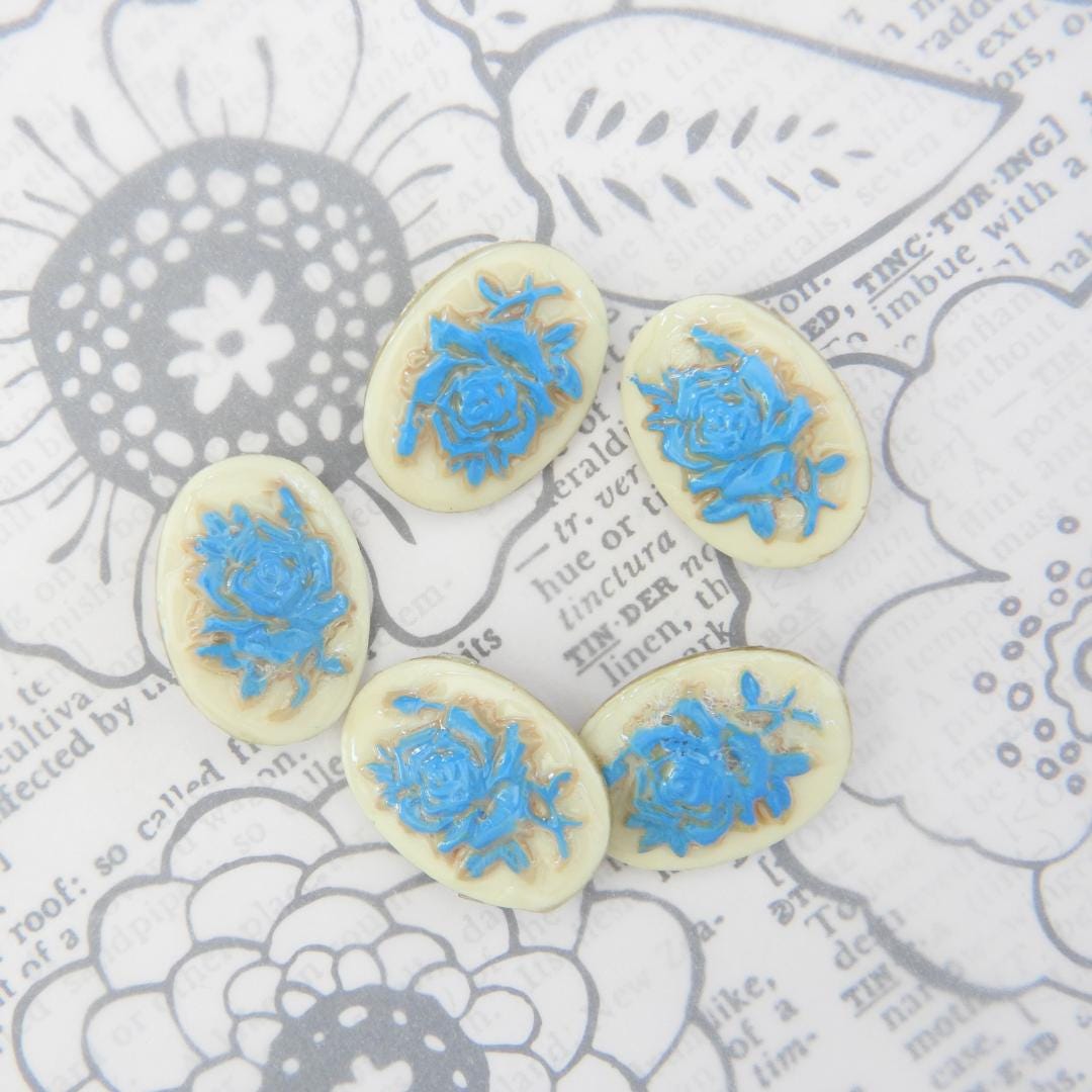 Vintage-inspired set of 5 oval cameo buttons with floral design, perfect for sewing, crafts, and jewelry making. Gift-ready for creatives!
