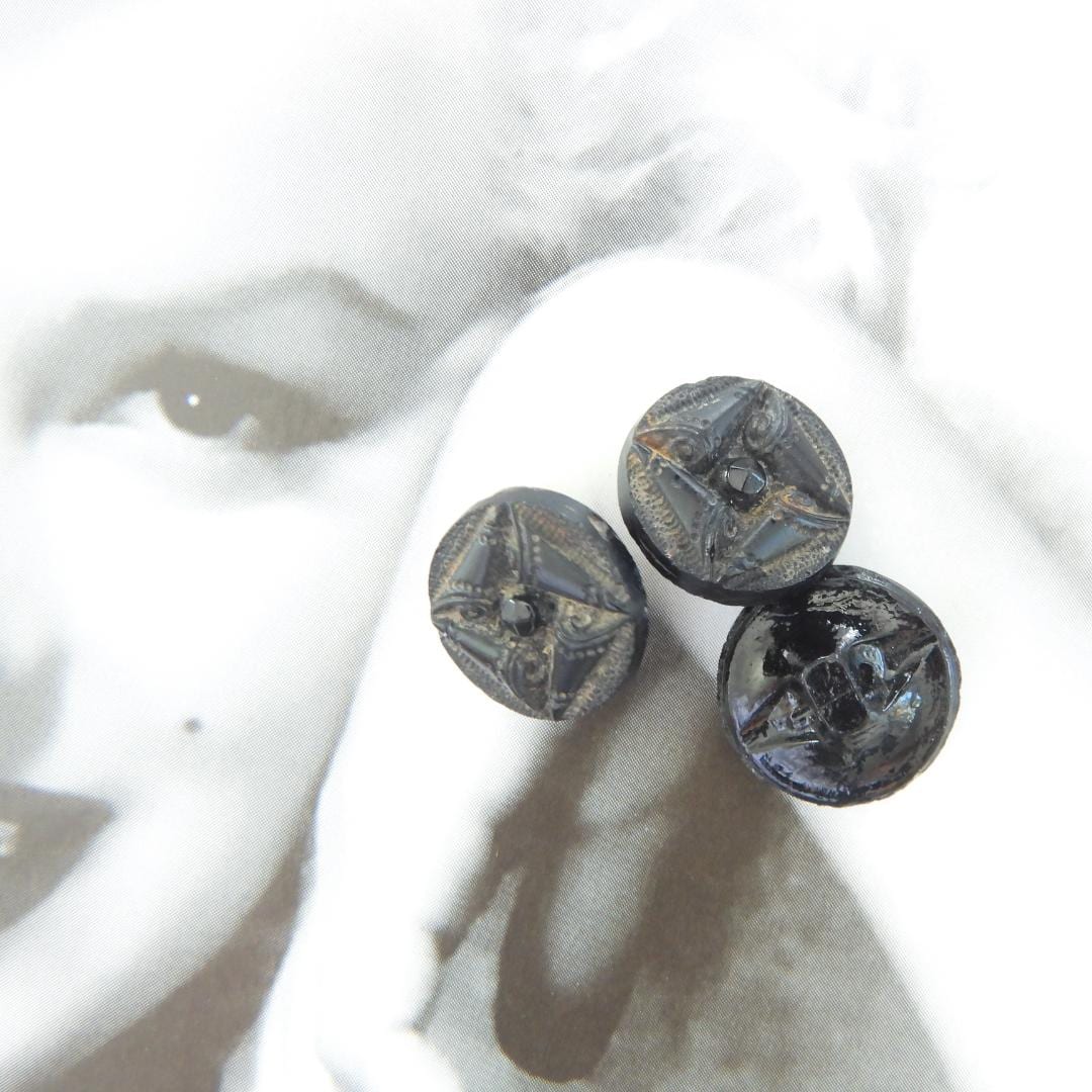 Black antique glass buttons with a shank