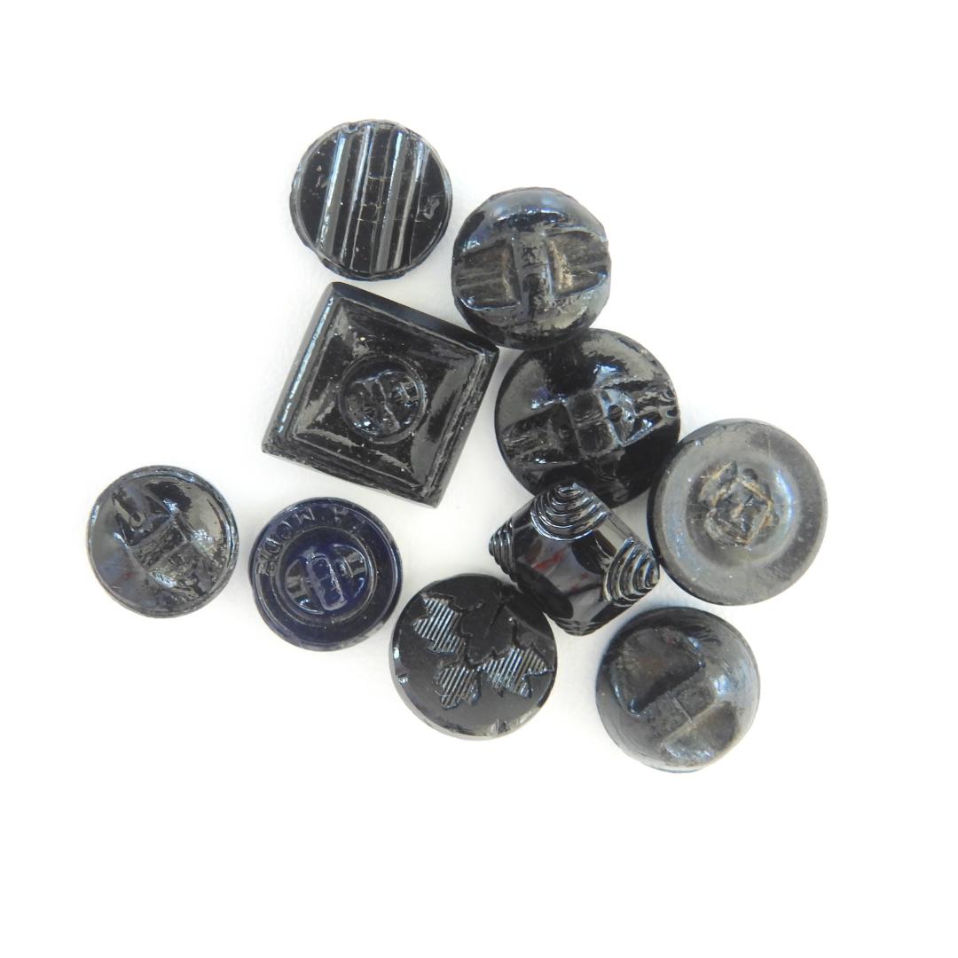 10 Czech black glass buttons from Europe. Perfect embellishments for thrifted or inherited garments—perfect for upcycling. With a shank back