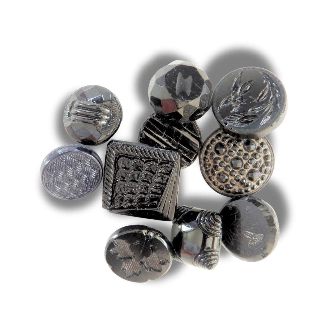 10 Czech black glass buttons from Europe. Perfect embellishments for thrifted or inherited garments—perfect for upcycling. With a shank back