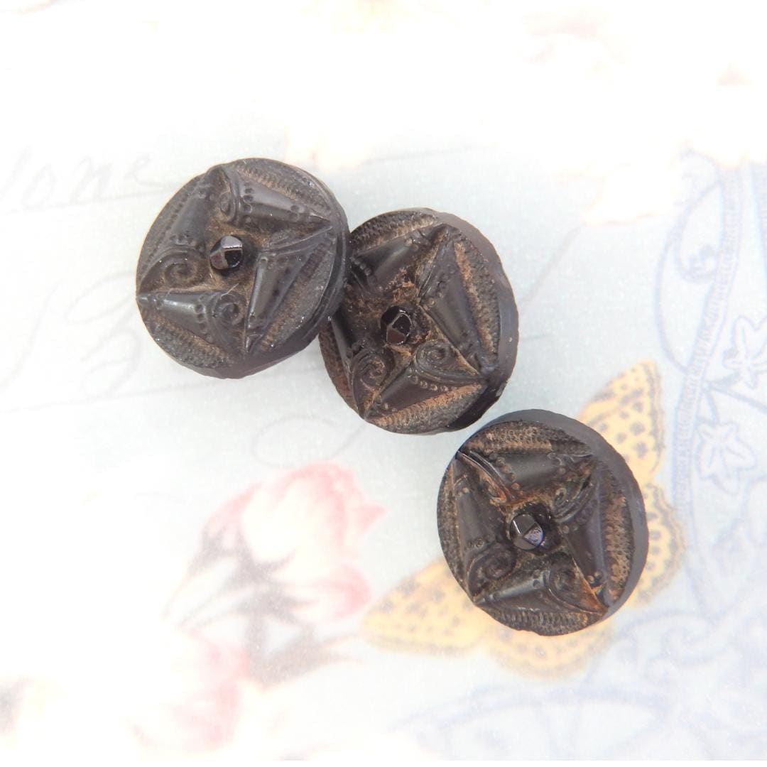 Black antique glass buttons with a shank