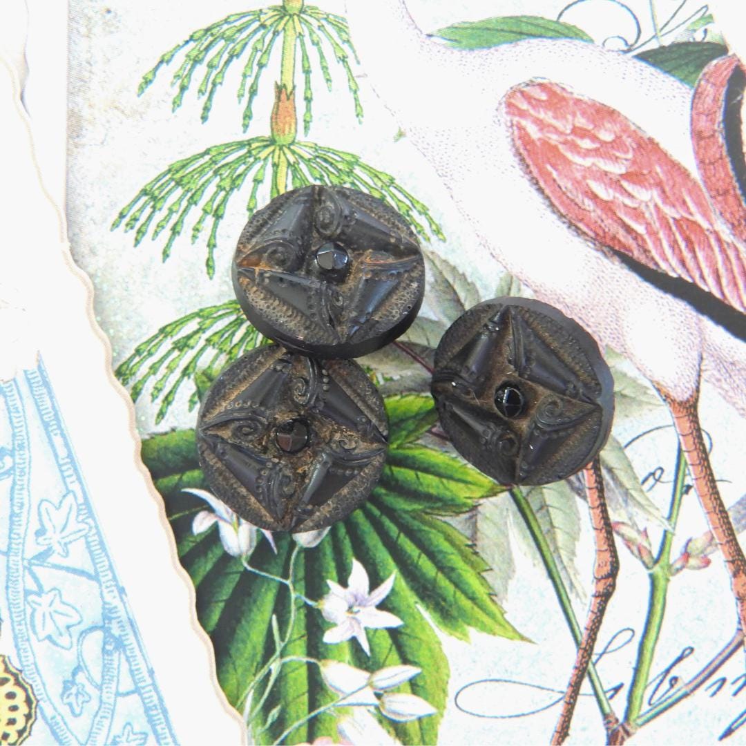 Black antique glass buttons with a shank