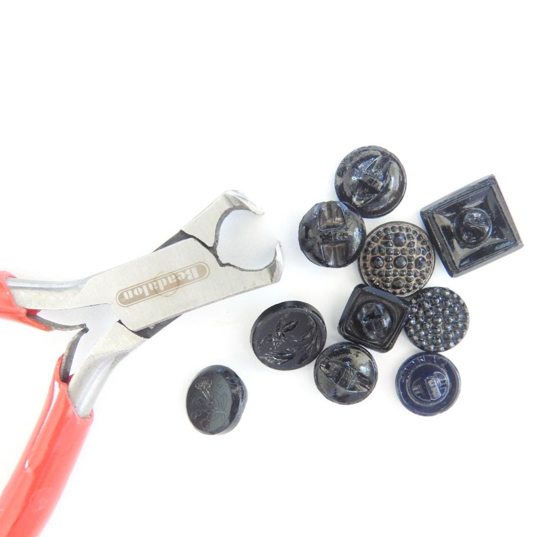 10 Czech black glass buttons from Europe. Perfect embellishments for thrifted or inherited garments—perfect for upcycling. With a shank back