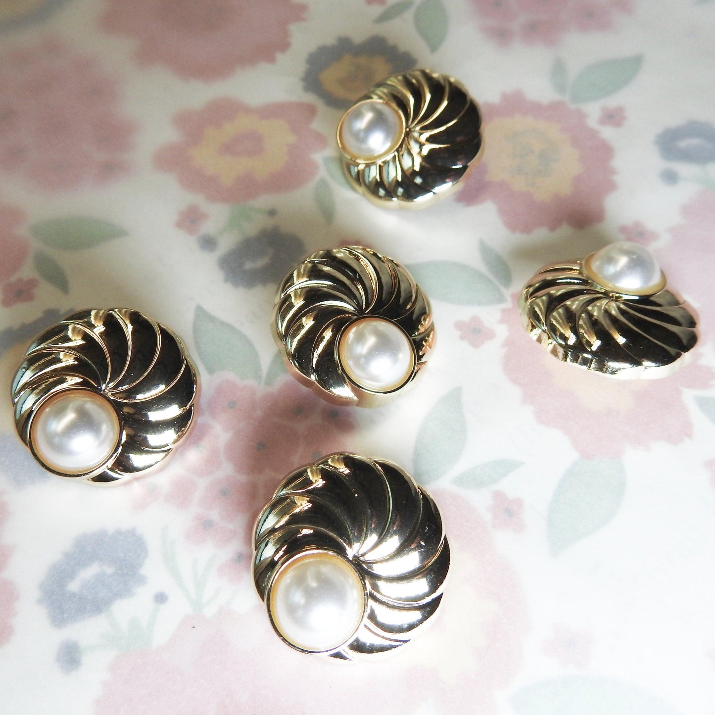 gold colored large pearl buttons