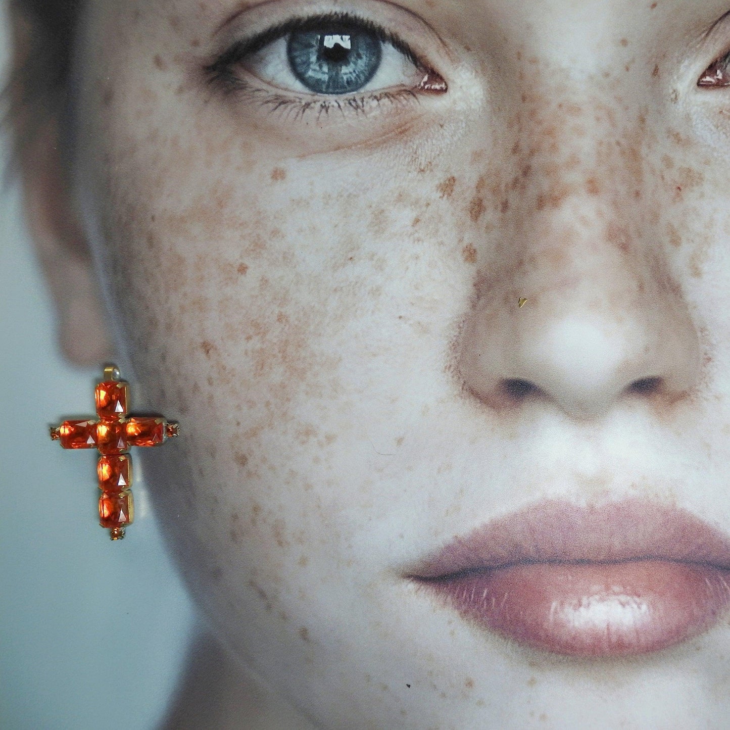 orange glass cross pendant