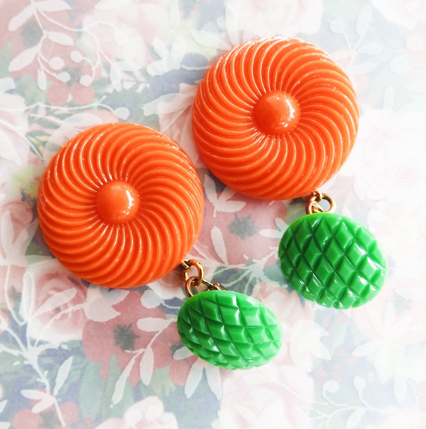 Neon orange dangle clip earrings for women. Cool jewelry gift ideas under 25 dollars. 1970s 1980s-inspired funky style. Ready to ship