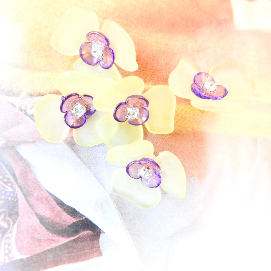 Flower-shaped buttons for clothes. Purple and yellow, with a shank. To sew on cardigans, dresses, and embellished lace. Sewing gifts ideas