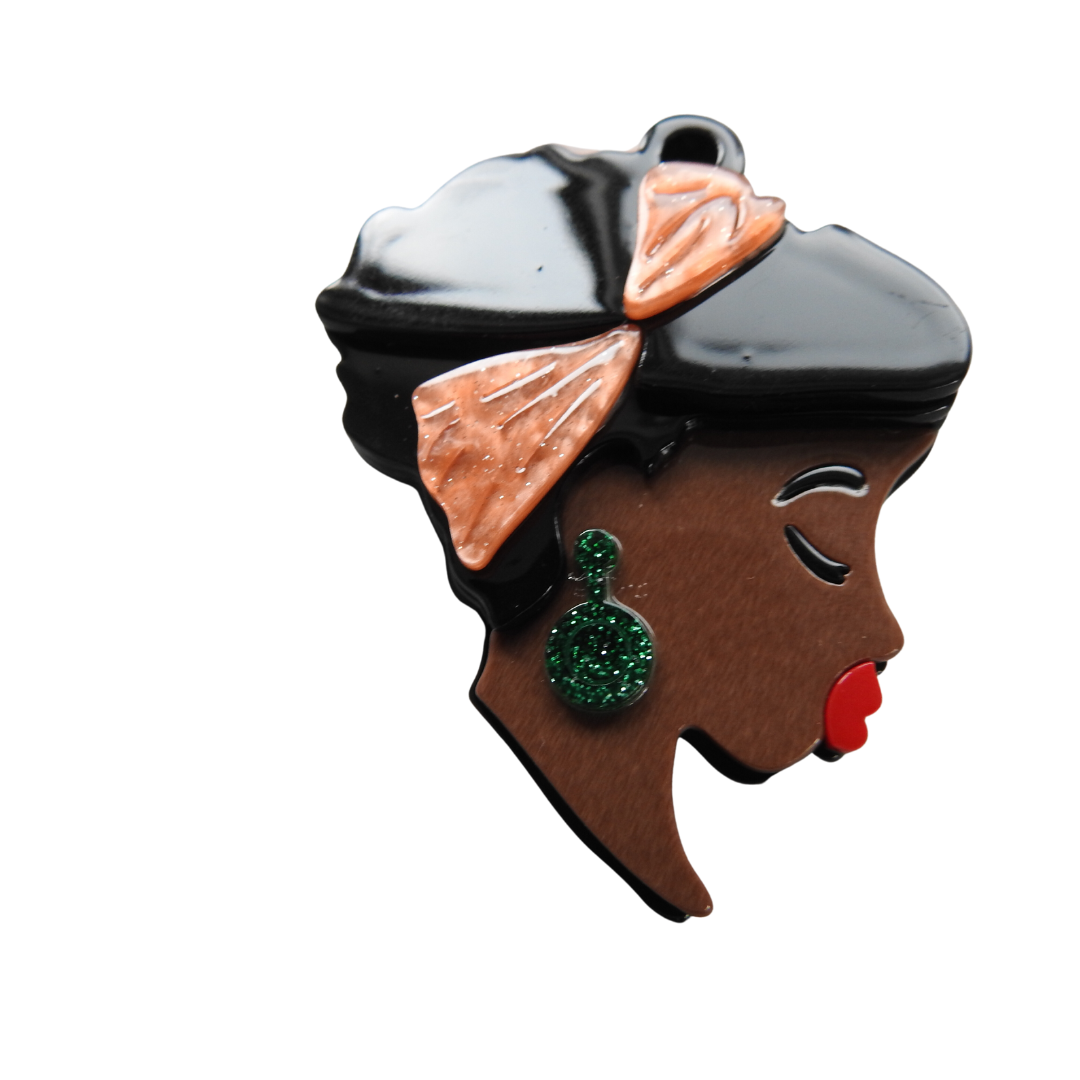 African lady's face brooch