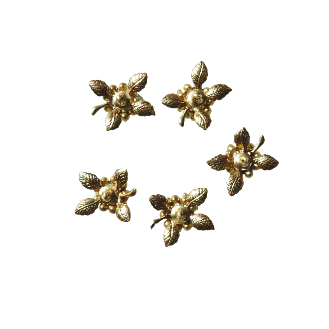 Mint-green flower-shaped decorative buttons.