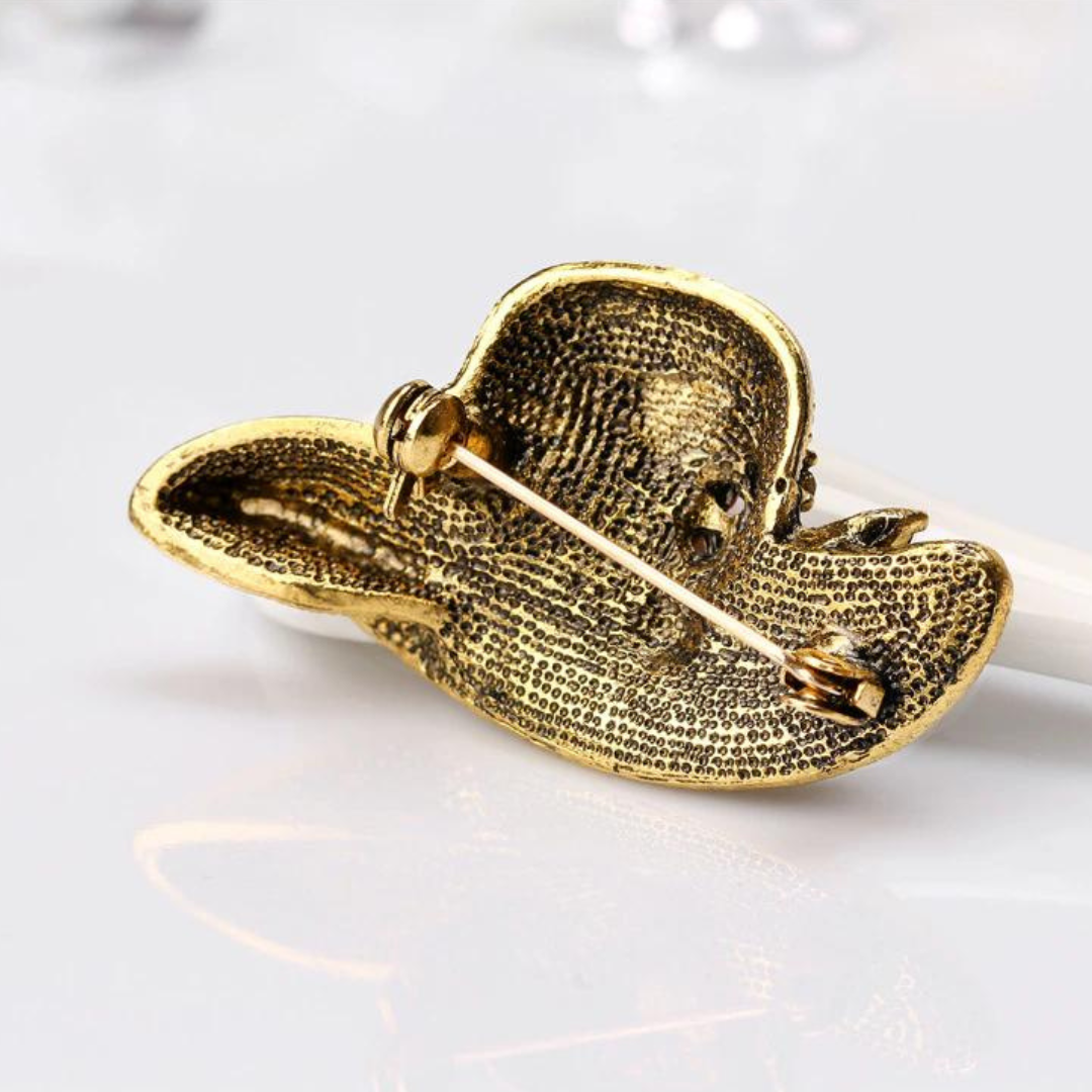 Small rhinestone brooch shaped like a hat