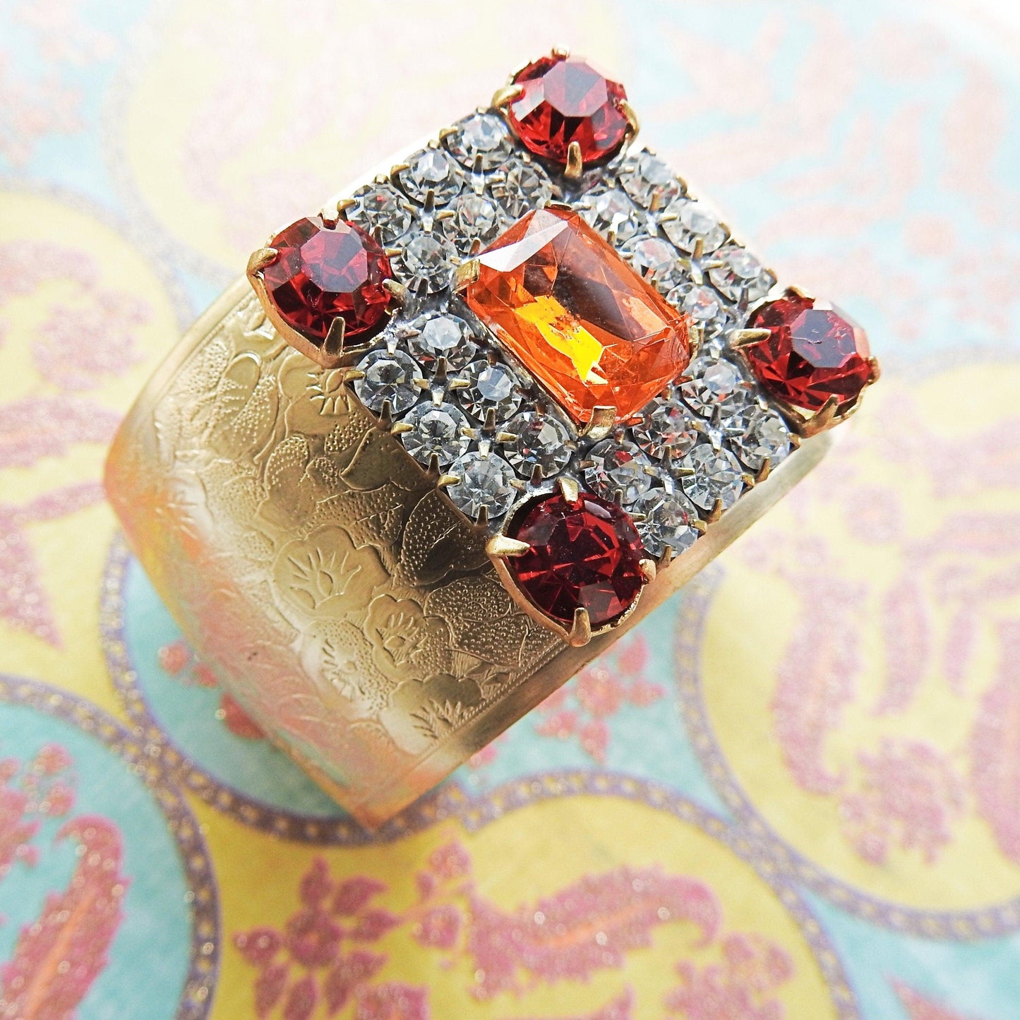 Crystal wide gold bracelet for ladies, made from a large sparkly orange geometric sparkly Czech glass button, anthro inspired bangle jewelry