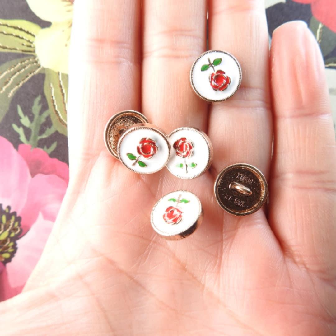 buttons with a flower rose on them