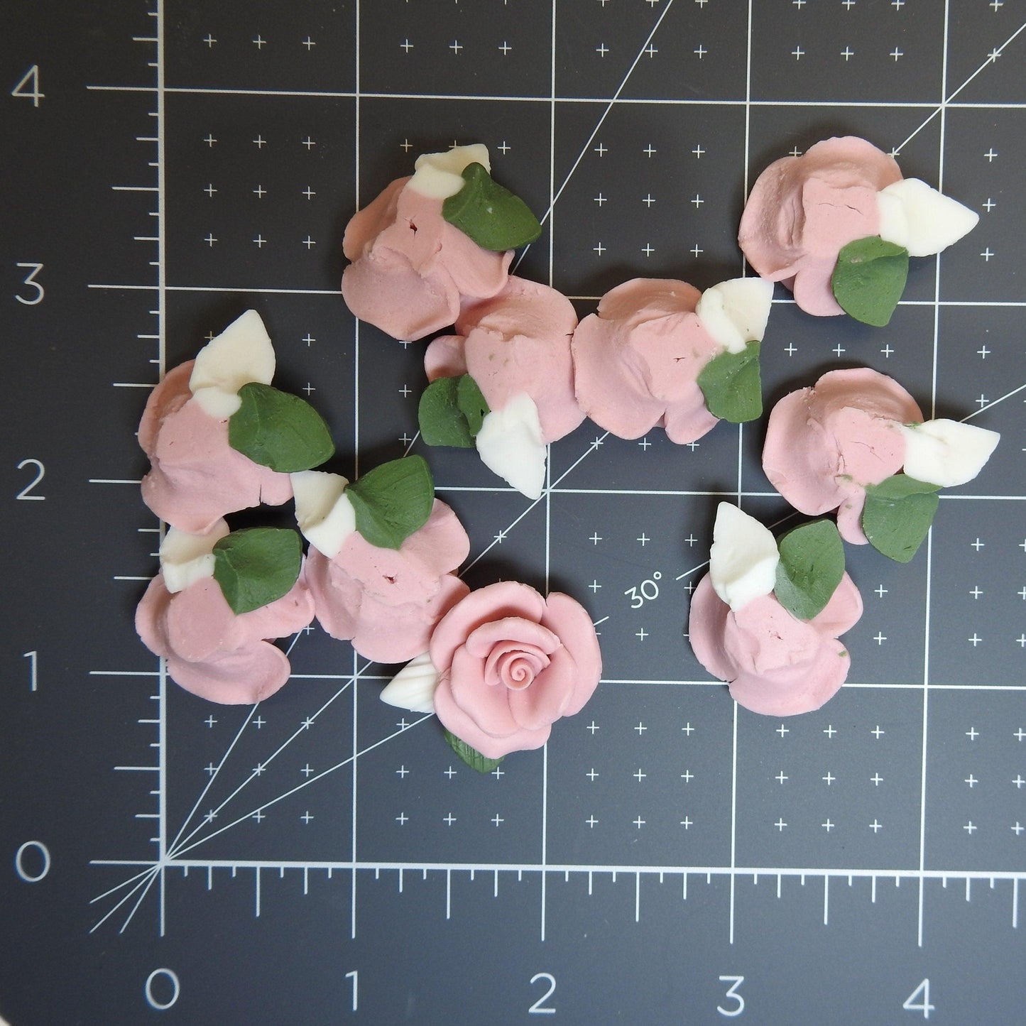 Dusty pink flower cabochons, made from matte bisque ceramic clay with white and green leaves for gluing on DIY jewelry. Lot of 10, 23-25m