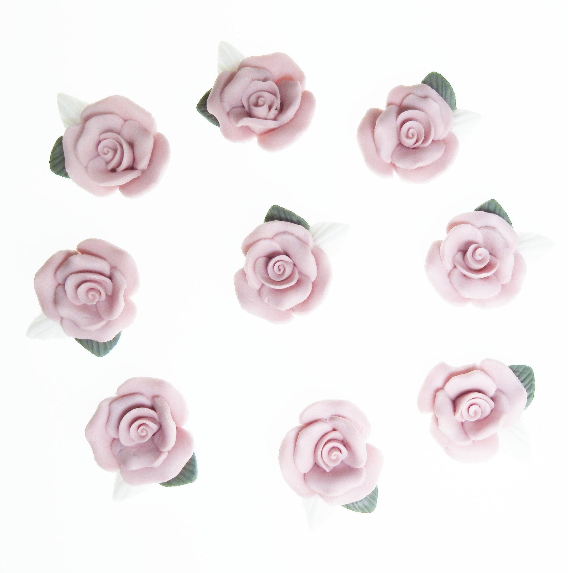 Dusty pink flower cabochons, made from matte bisque ceramic clay with white and green leaves for gluing on DIY jewelry. Lot of 10, 23-25m