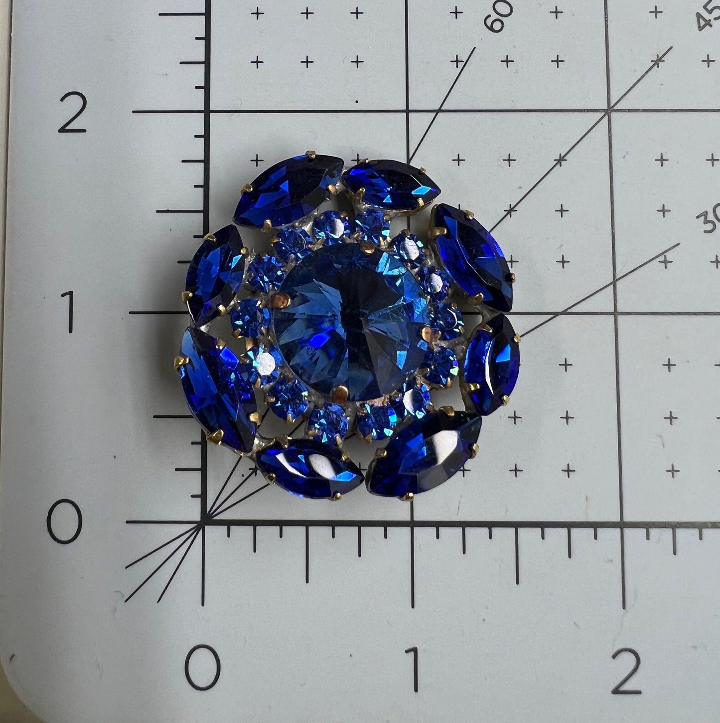 Gigantic blue crystal button made from fancy Czech glass. A nice way to add twinkle and glance to your outfit, accessory, or home decor.