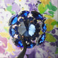 Gigantic blue crystal button made from fancy Czech glass. A nice way to add twinkle and glance to your outfit, accessory, or home decor.