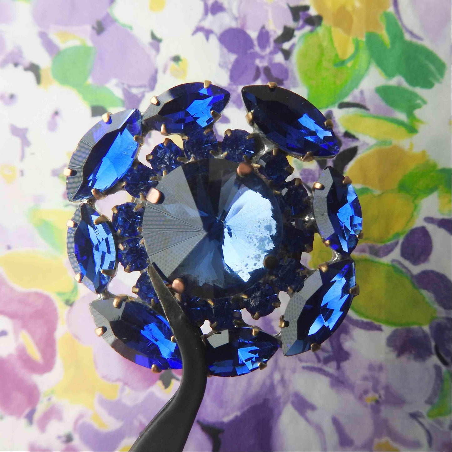 Gigantic blue crystal button made from fancy Czech glass. A nice way to add twinkle and glance to your outfit, accessory, or home decor.