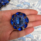 Gigantic blue crystal button made from fancy Czech glass. A nice way to add twinkle and glance to your outfit, accessory, or home decor.