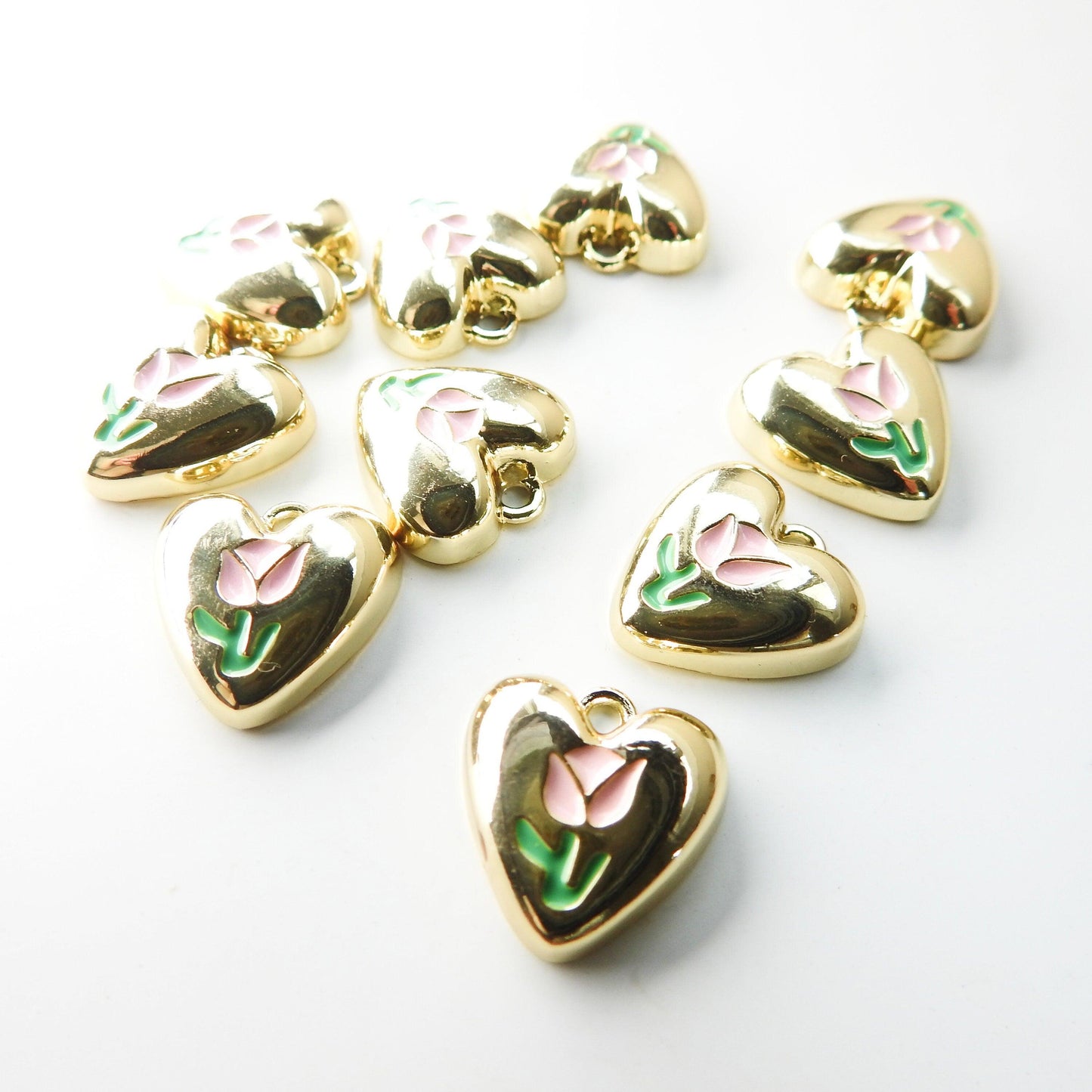 10 Heart shaped charms for bracelet, necklace, earrings, with a pink tulip flower on them. Cute jewelry-making supplies for pendants