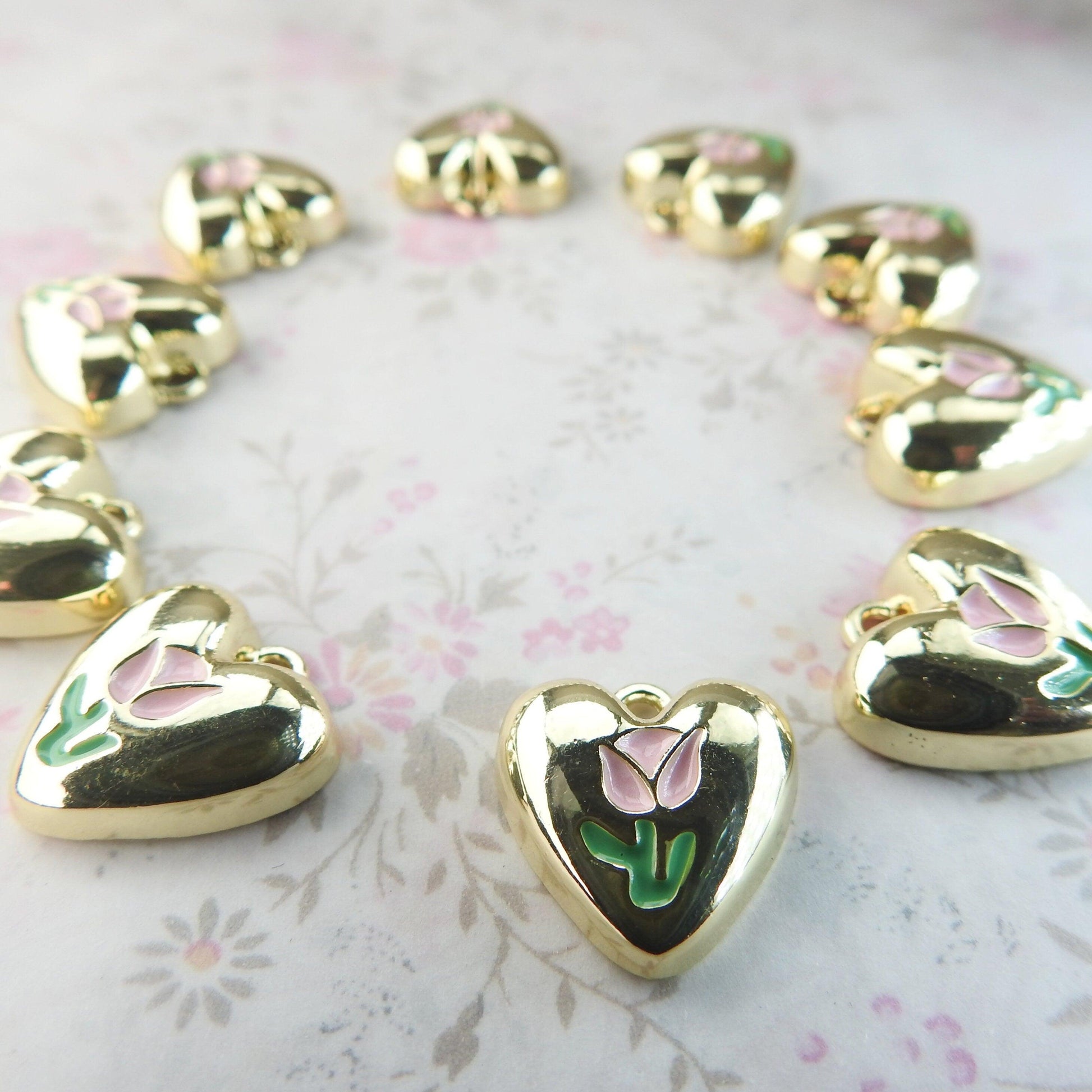 10 Heart shaped charms for bracelet, necklace, earrings, with a pink tulip flower on them. Cute jewelry-making supplies for pendants