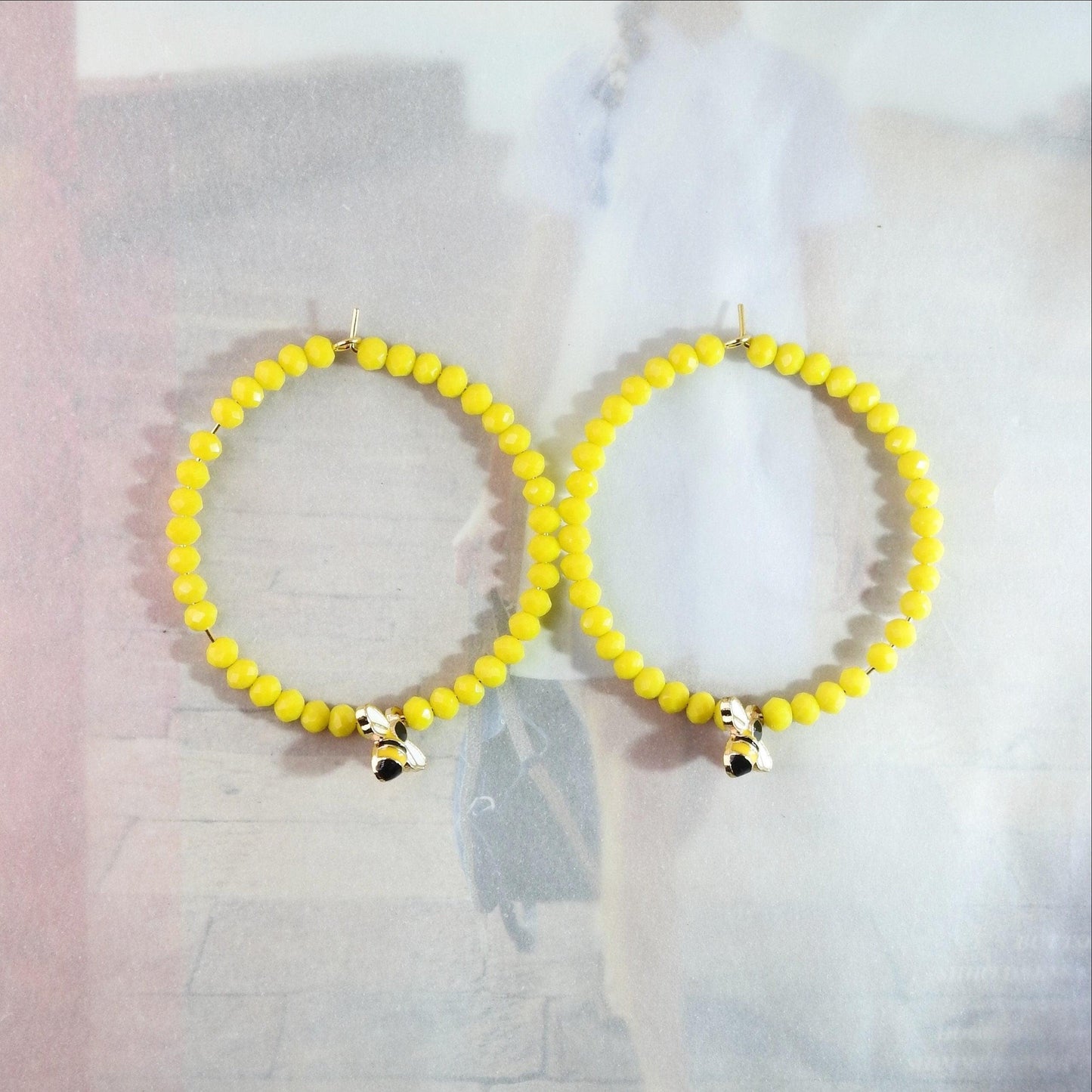 Honey bee earrings hoop for women, handmade in Canada with a cute bug charm and eye-catching yellow glass beads. Diameter about 45 mm, 2 in.