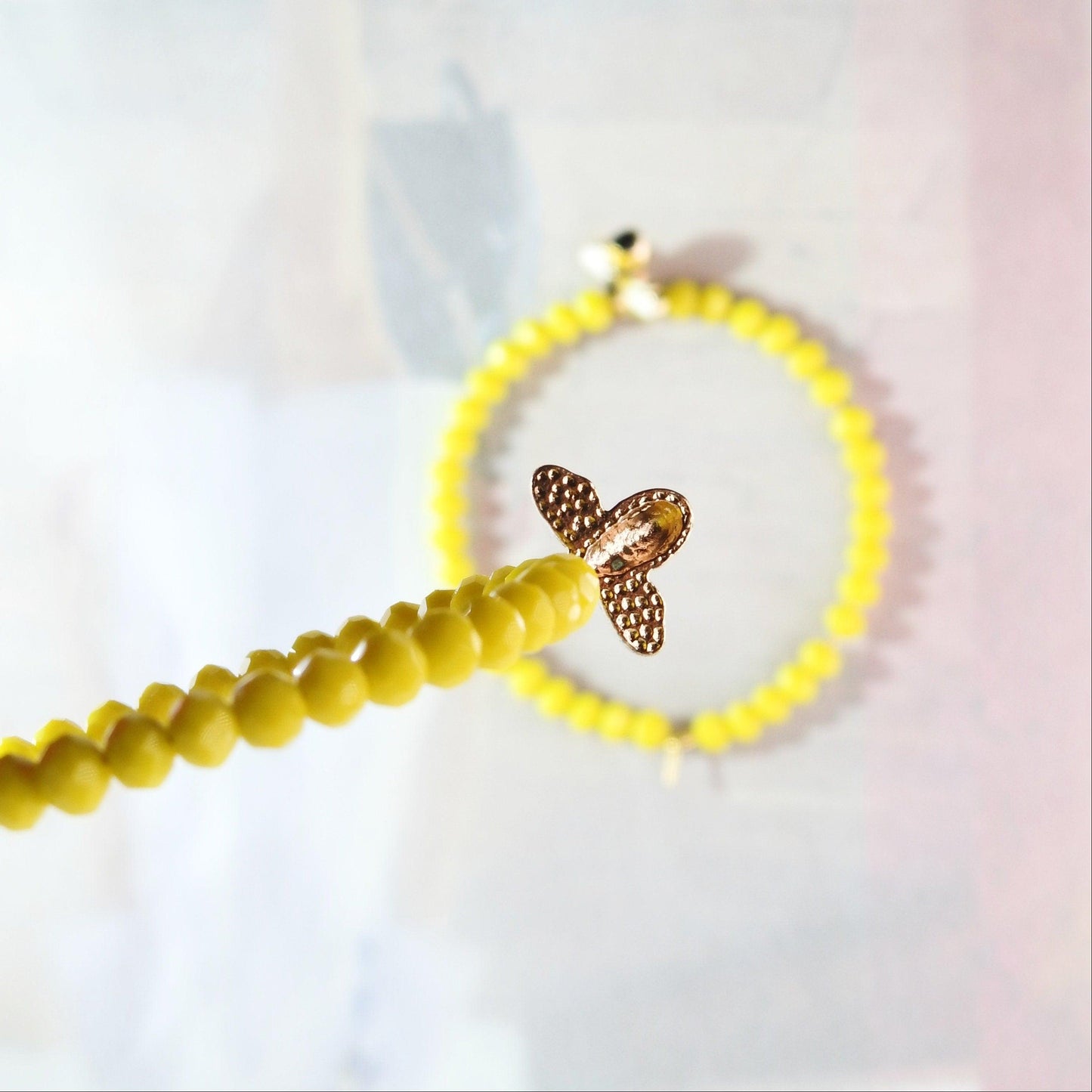 Honey bee earrings hoop for women, handmade in Canada with a cute bug charm and eye-catching yellow glass beads. Diameter about 45 mm, 2 in.