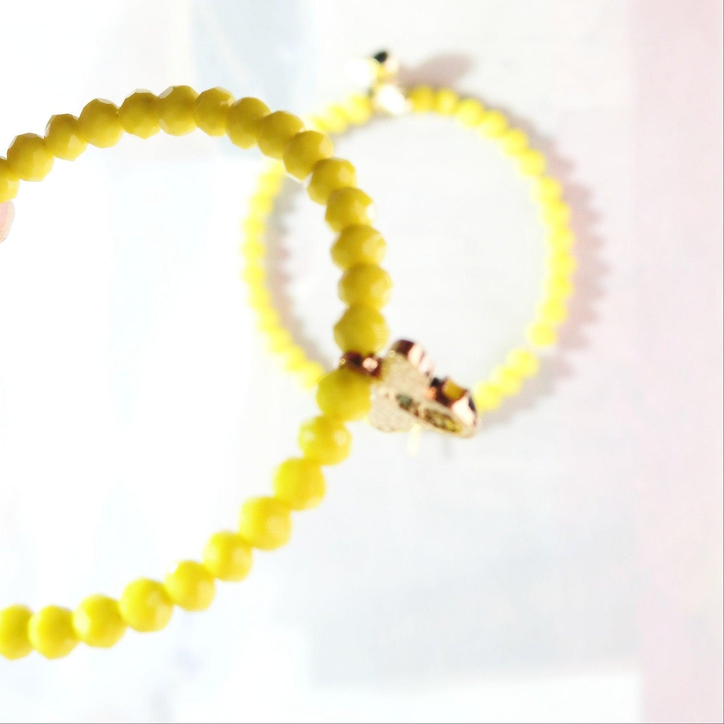 Honey bee earrings hoop for women, handmade in Canada with a cute bug charm and eye-catching yellow glass beads. Diameter about 45 mm, 2 in.