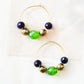 Cute colorful beaded hoop earrings, purple, green, and gold, with colored faceted beads. Pretty circle dangle earrings, handmade, 30 mm.