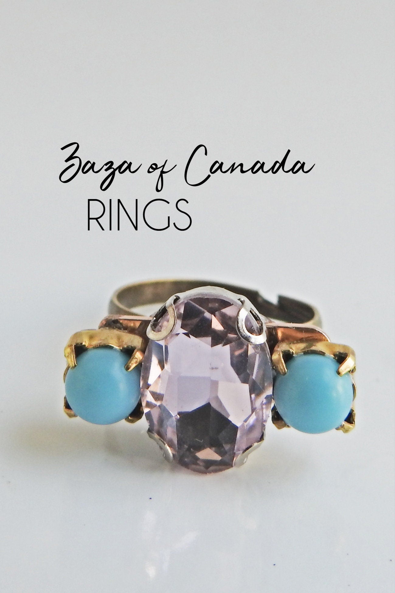 Light pink ring with blue stones