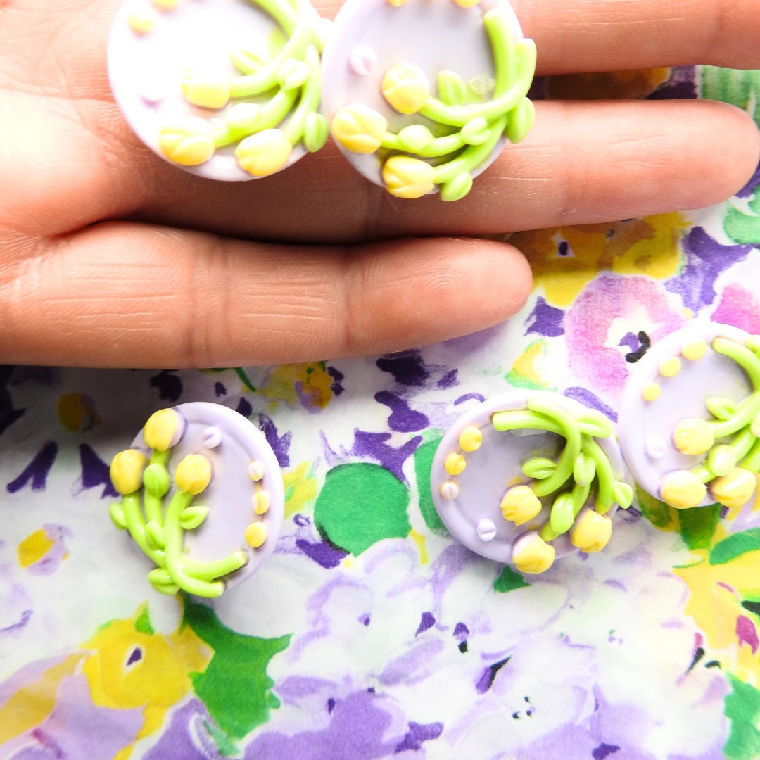 Purple buttons with yellow tulips flowers