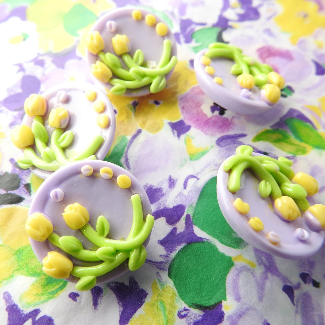 Purple buttons with yellow tulips flowers