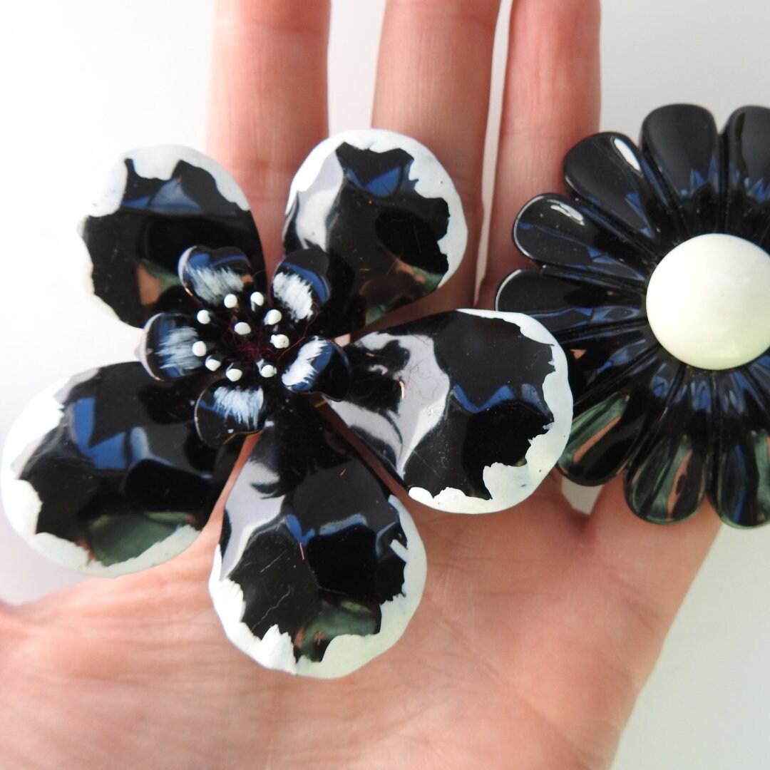 Black vintage enamel flower brooches