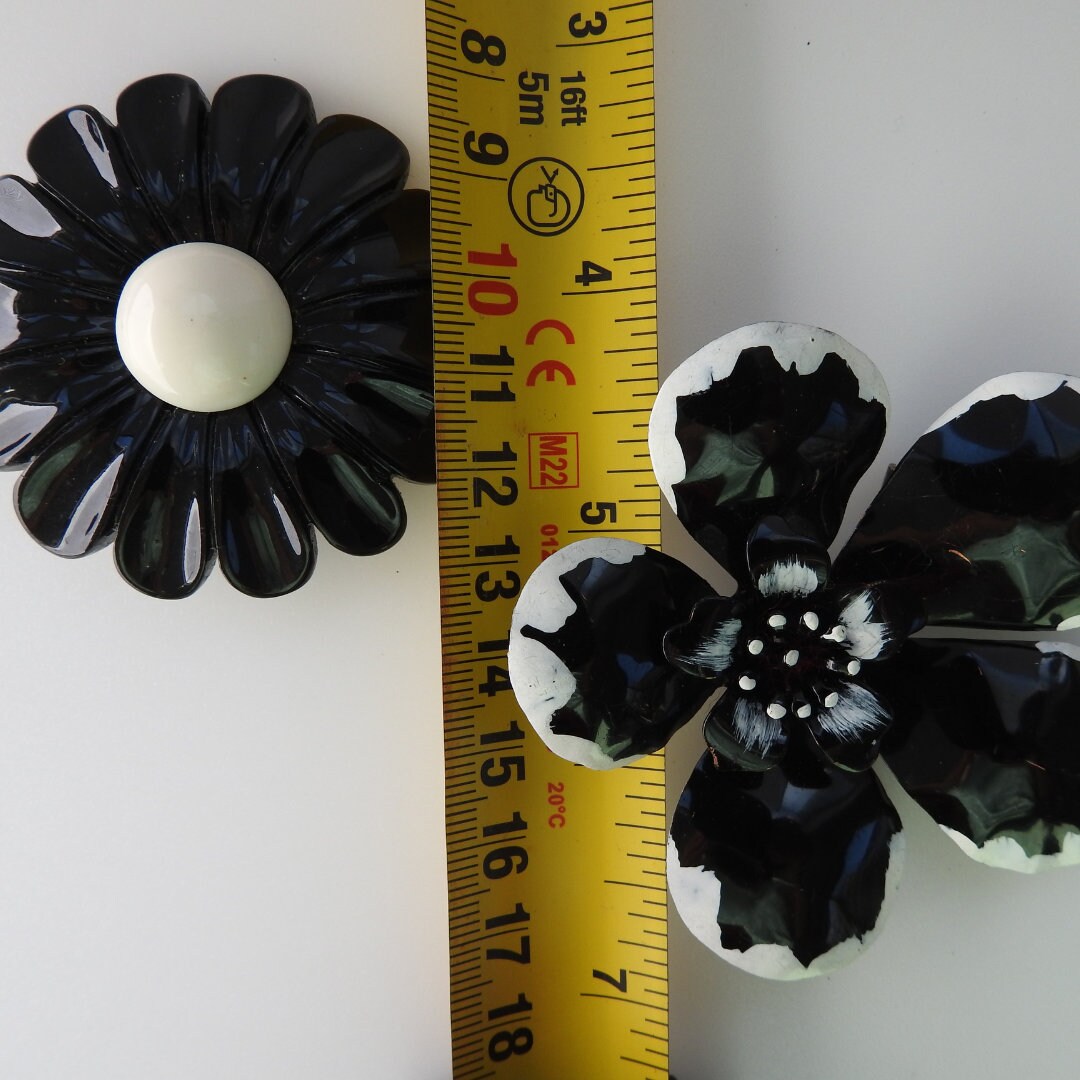 Black vintage enamel flower brooches