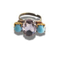 Light pink ring with blue stones