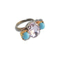 Light pink ring with blue stones