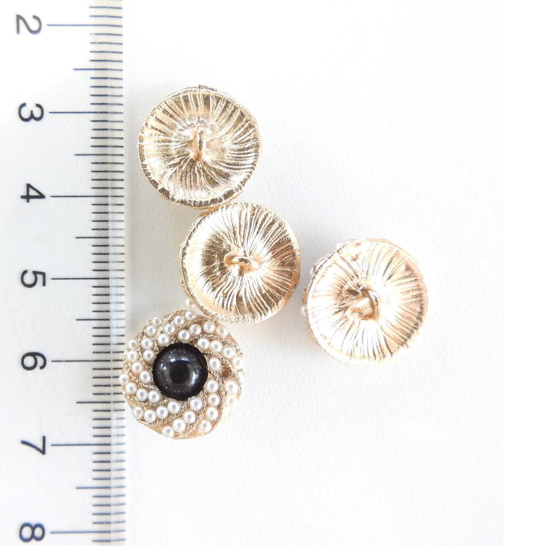 Chic black and gold buttons with tiny pearls—Nice for decorating blouses, sweaters, cardigans, shoes. A fancy touch for any sewing project!