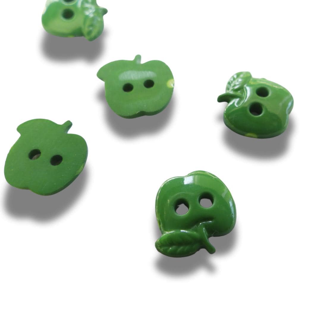 Set of 12 green apple-shaped buttons for sewing and crafting. 2-hole design, perfect for fun DIY projects, clothing, and accessories.