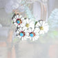 Daisy flower-shaped buttons! Hand-painted with a cute blue rhinestone center. For crafting, sewing, fashion, wedding decor. Set of 5, 13 mm
