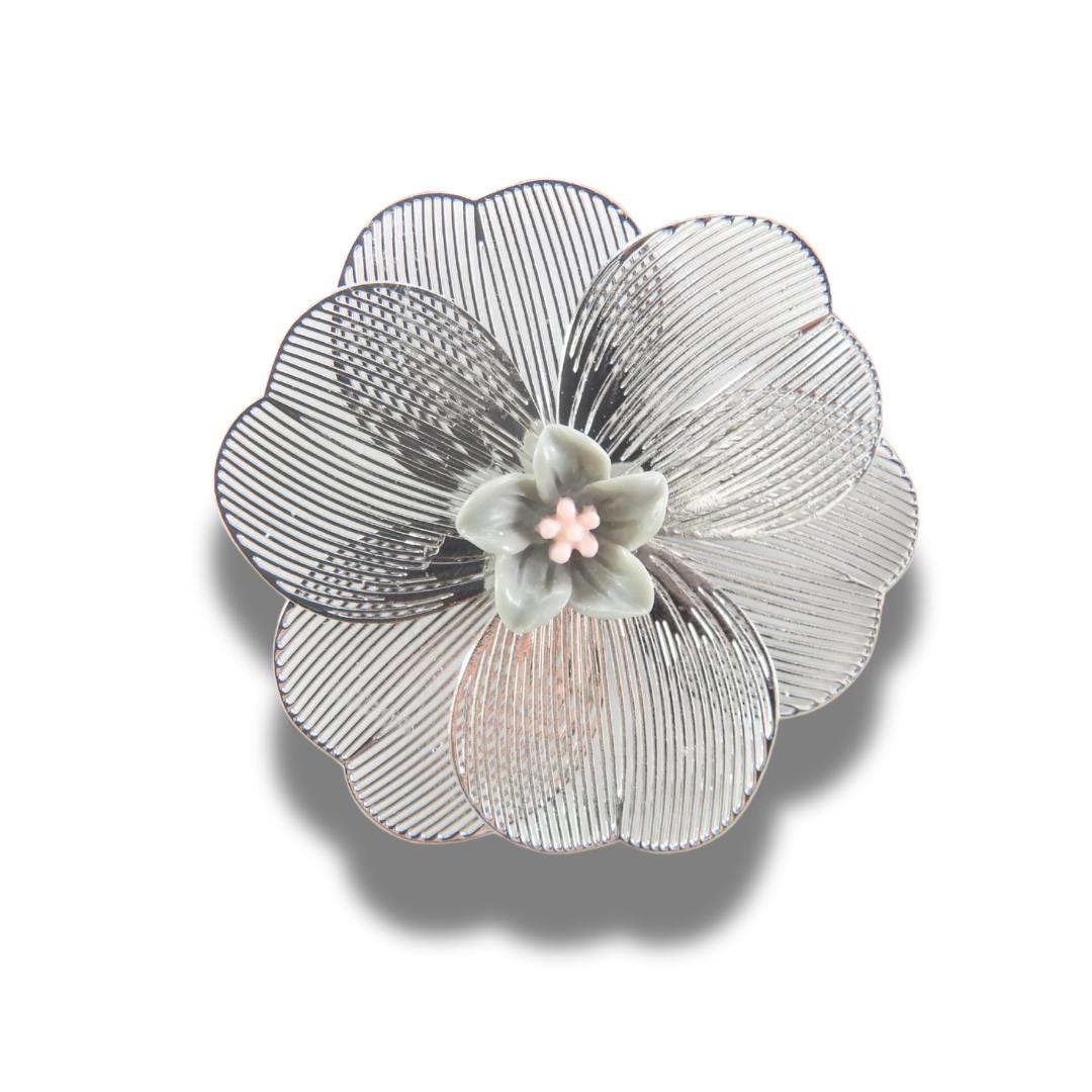 Oversized 40 mm flower button with silver petals, grey and pink floral center, shank back. Lightweight and perfect for sewing or crafts