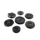 Set of 7 antique Victorian black glass buttons for sewing - 2-hole, 8–15 mm, Czech molded glass. Glossy floral & geometric patterns