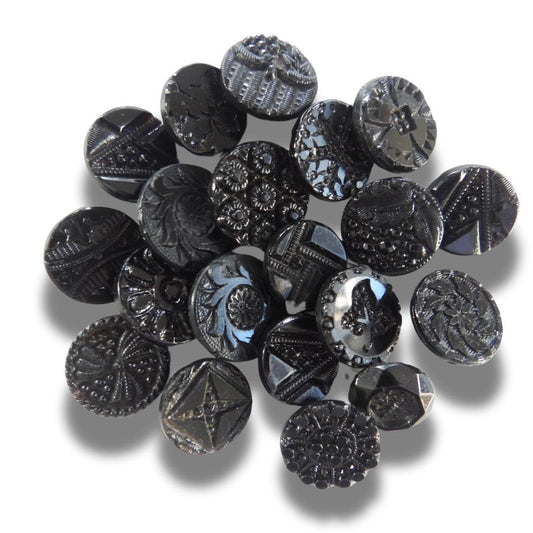 20 Czech black glass buttons from Europe. Perfect embellishments for thrifted or inherited garments—perfect for upcycling. With a shank back