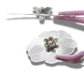 Oversized 40 mm flower button with silver petals, grey and pink floral center, shank back. Lightweight and perfect for sewing or crafts