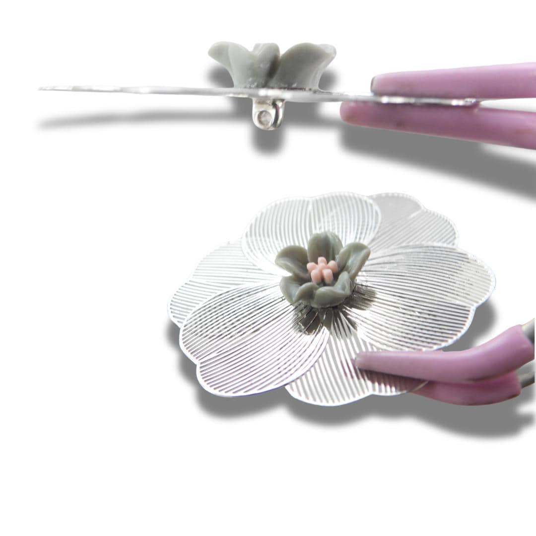 Oversized 40 mm flower button with silver petals, grey and pink floral center, shank back. Lightweight and perfect for sewing or crafts