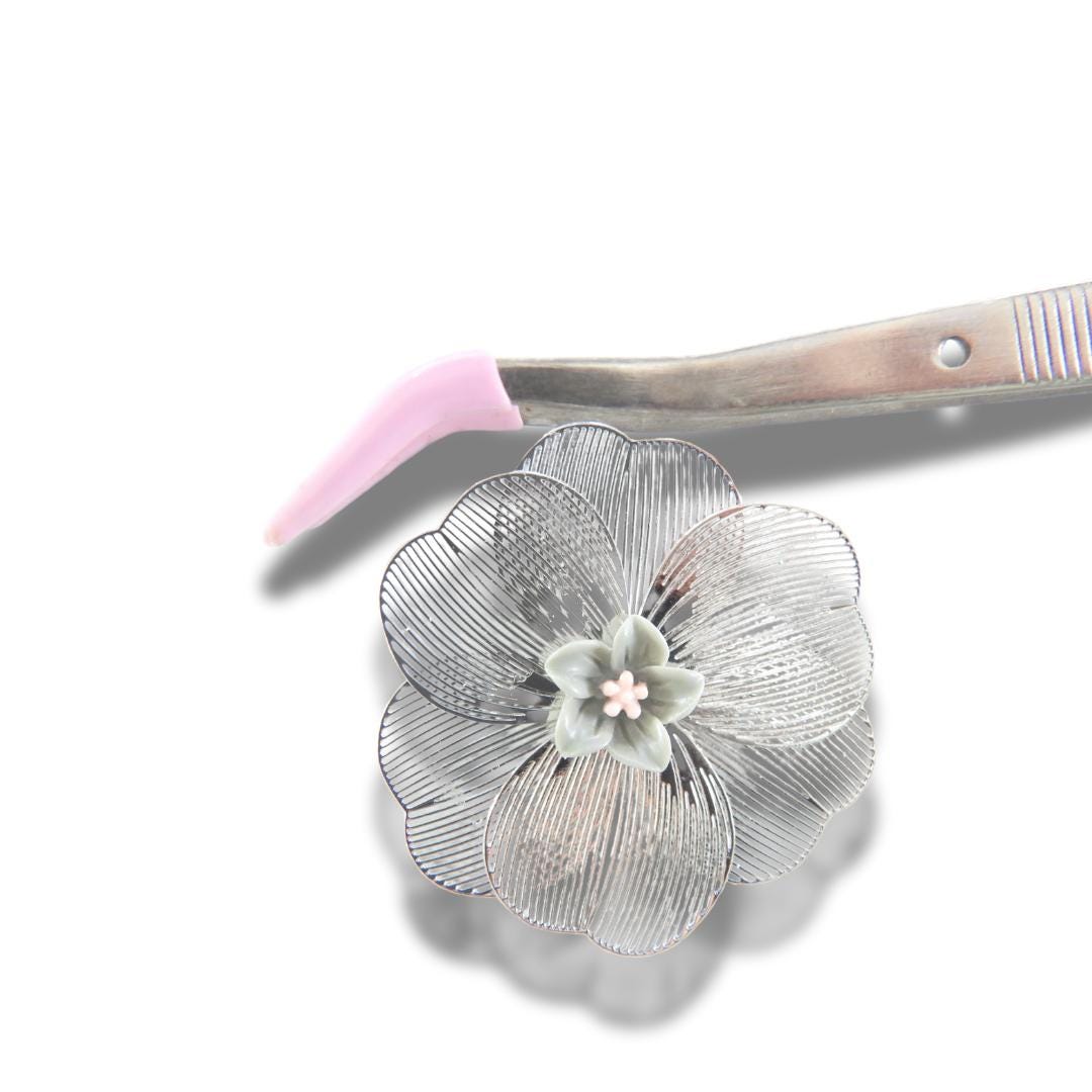 Oversized 40 mm flower button with silver petals, grey and pink floral center, shank back. Lightweight and perfect for sewing or crafts
